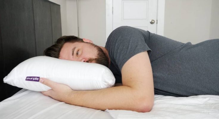Side sleeper resting comfortably on Purple Harmony Pillow with visible grid technology